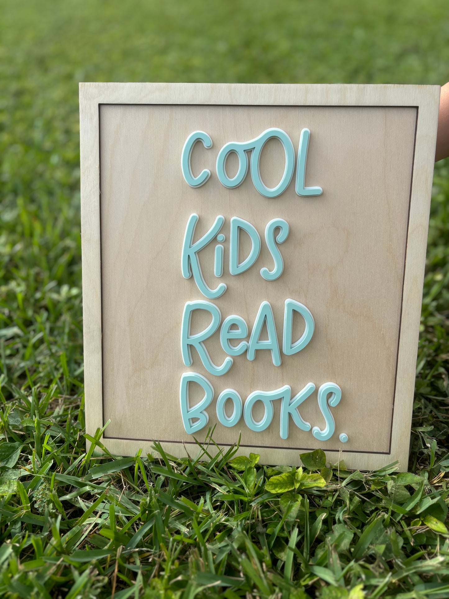 Cool kids read books sign