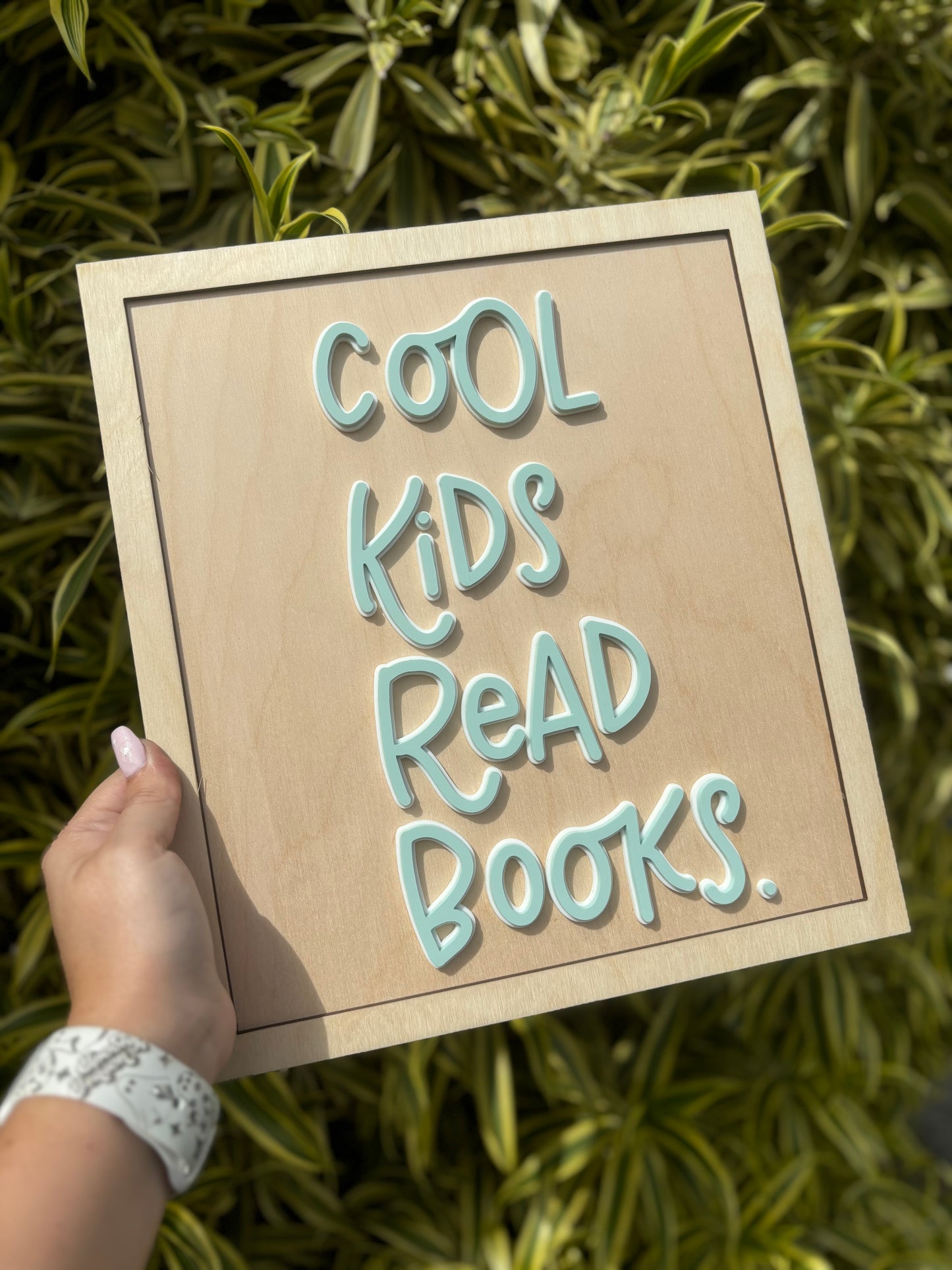 Cool kids read books sign